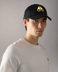 MOOSE KNUCKLES CAP LOGO ICON CAP-GOLD ZWART - GOUD